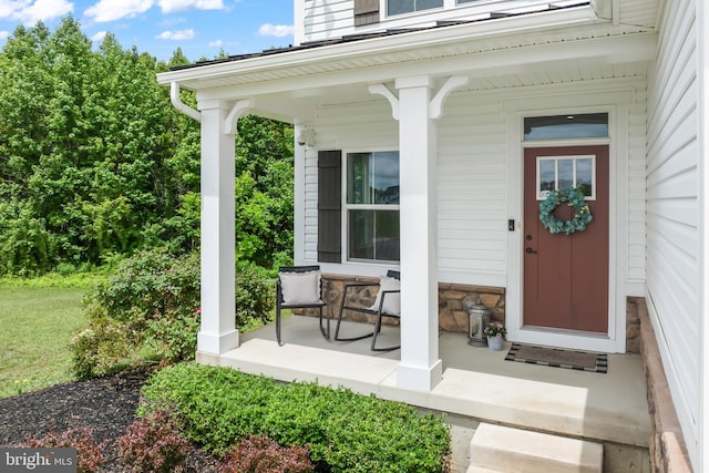 57 Oak Ln, Carneys Point, NJ 08069 - view of exterior entry with a porch and stone siding