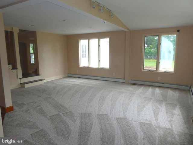 126 E Central Ave, Hammonton, NJ 08037 - carpeted empty room featuring a baseboard radiator, plenty of natural light, and rail lighting