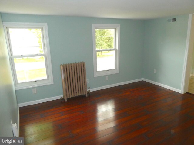126 E Central Ave, Hammonton, NJ 08037 - unfurnished room featuring radiator and wood finished floors