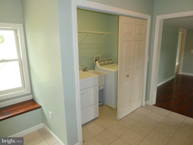 126 E Central Ave, Hammonton, NJ 08037 - laundry room with washing machine and dryer and light tile patterned flooring