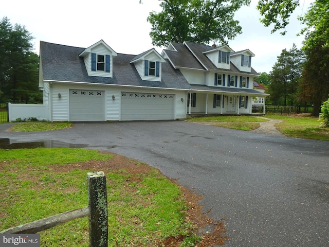 126 E Central Ave, Hammonton, NJ 08037 - view of front of house with a porch, driveway, an attached garage, and roof with shingles