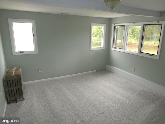 126 E Central Ave, Hammonton, NJ 08037 - unfurnished room with radiator heating unit, healthy amount of natural light, and carpet