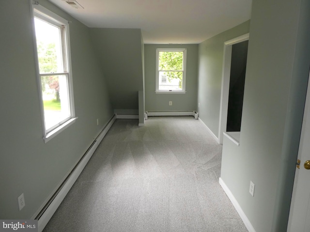 126 E Central Ave, Hammonton, NJ 08037 - empty room with a baseboard heating unit and light carpet