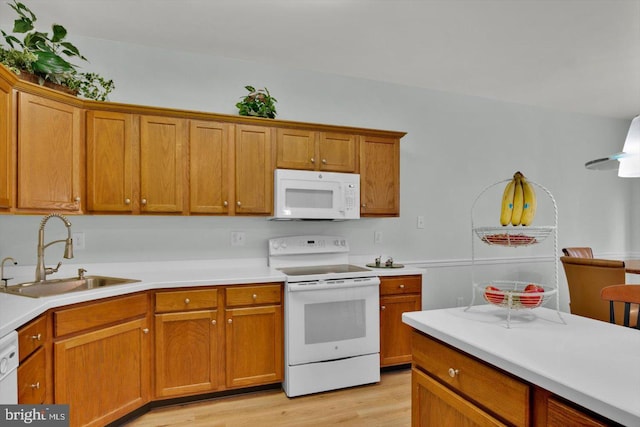 131 Sequoia Dr, Berlin, NJ 08009 - kitchen featuring white appliances, brown cabinets, light wood-style flooring, and light countertops