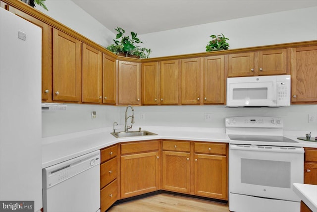 131 Sequoia Dr, Berlin, NJ 08009 - kitchen featuring white appliances, light wood-type flooring, light countertops, and brown cabinetry