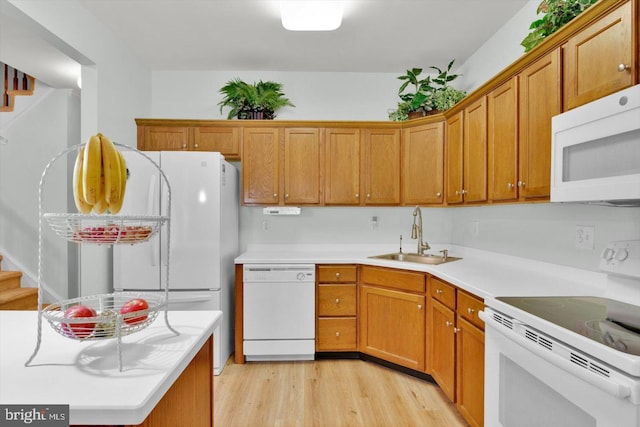 131 Sequoia Dr, Berlin, NJ 08009 - kitchen with white appliances, light wood-type flooring, light countertops, and brown cabinetry