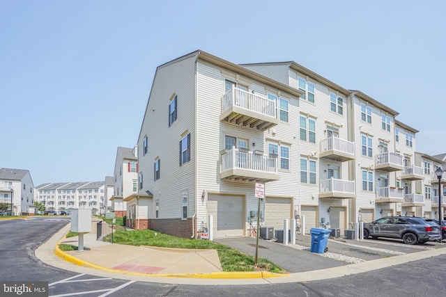 7493 Brunson Cir, Gainesville, VA 20155 - view of apartment building / complex featuring a garage