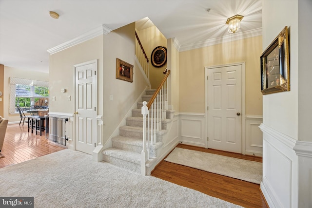272 Center Point Ln, Lansdale, PA 19446 - foyer entrance with wood finished floors, crown molding, stairs, and a wainscoted wall