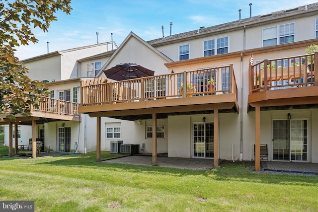 272 Center Point Ln, Lansdale, PA 19446 - back of house featuring stucco siding, a deck, a yard, and a patio area