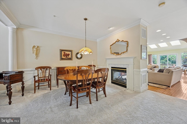 272 Center Point Ln, Lansdale, PA 19446 - dining area featuring crown molding, carpet floors, a premium fireplace, decorative columns, and a wainscoted wall