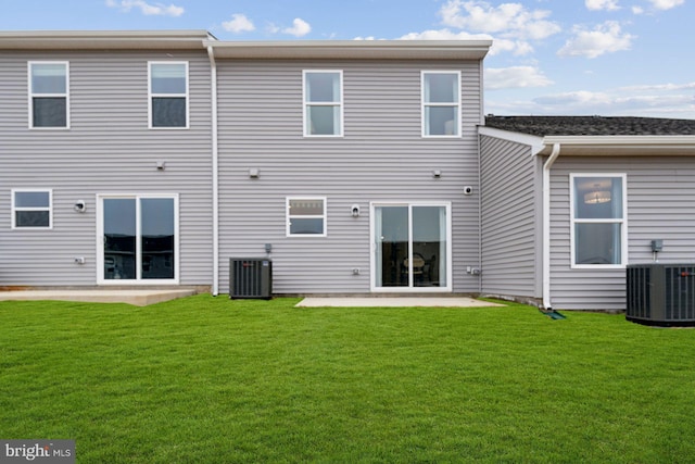 219 Olympus Rd, Charles Town, WV 25414 - back of house featuring a patio, cooling unit, and a yard