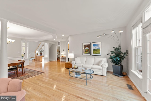 43665 Jernigan Ter, Leesburg, VA 20176 - living room with stairs, hardwood / wood-style flooring, recessed lighting, a chandelier, and ornate columns