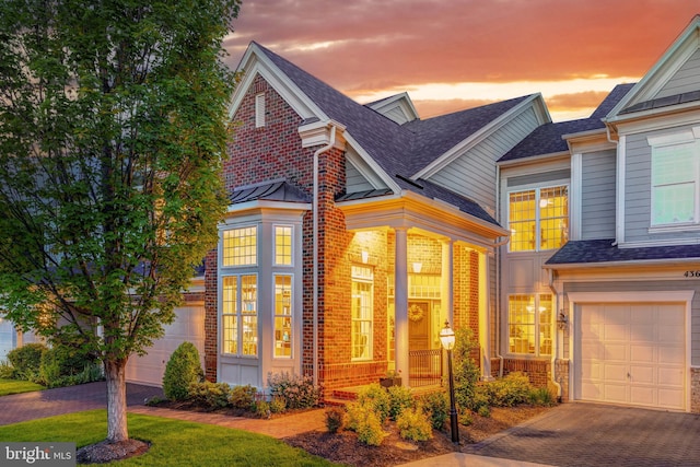 43665 Jernigan Ter, Leesburg, VA 20176 - traditional-style house featuring decorative driveway, brick siding, and a shingled roof