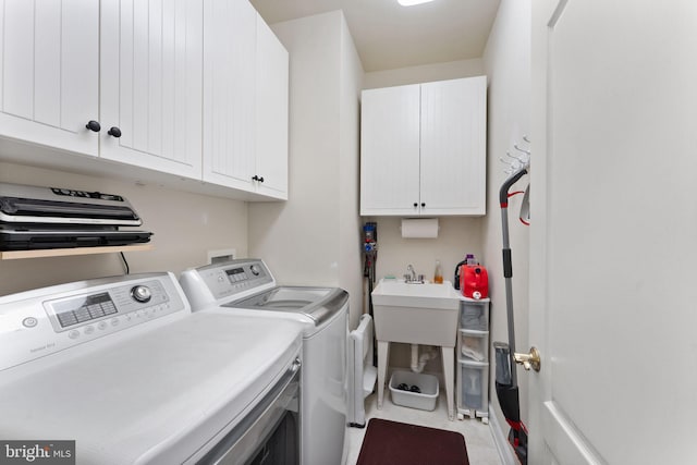 43665 Jernigan Ter, Leesburg, VA 20176 - laundry area featuring cabinet space and washing machine and clothes dryer