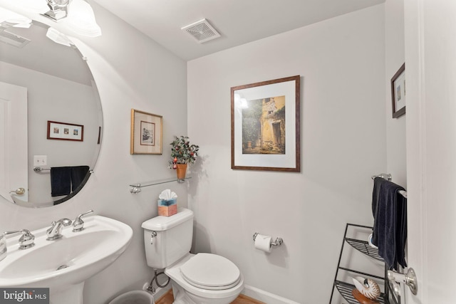 43665 Jernigan Ter, Leesburg, VA 20176 - half bathroom featuring a sink and toilet