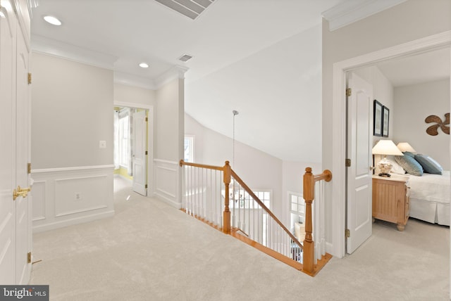 43665 Jernigan Ter, Leesburg, VA 20176 - hallway featuring an upstairs landing, light colored carpet, ornamental molding, a wainscoted wall, and recessed lighting