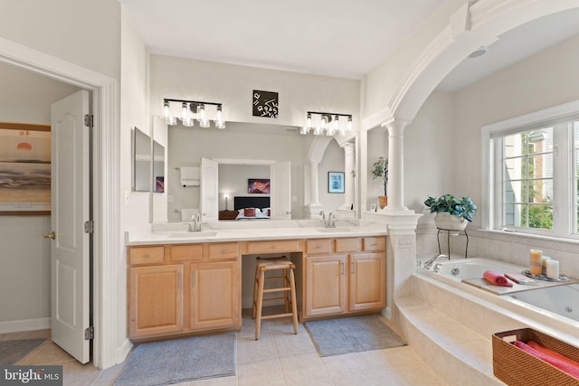 43665 Jernigan Ter, Leesburg, VA 20176 - bathroom featuring ornate columns, double vanity, a jetted tub, and tile patterned flooring