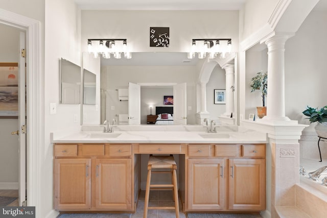 43665 Jernigan Ter, Leesburg, VA 20176 - bathroom featuring ornate columns, connected bathroom, double vanity, and tile patterned floors