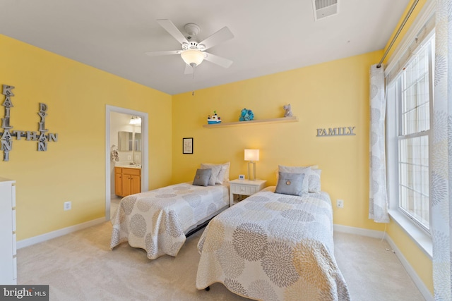 43665 Jernigan Ter, Leesburg, VA 20176 - bedroom featuring multiple windows, light carpet, and ensuite bathroom