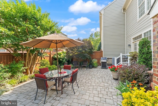 43665 Jernigan Ter, Leesburg, VA 20176 - fenced backyard with a patio area and outdoor dining area