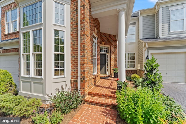 43665 Jernigan Ter, Leesburg, VA 20176 - property entrance with brick siding and a garage