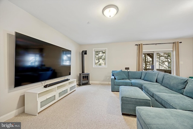 121 Valley Pl, Media, PA 19063 - living room with a wood stove and light colored carpet