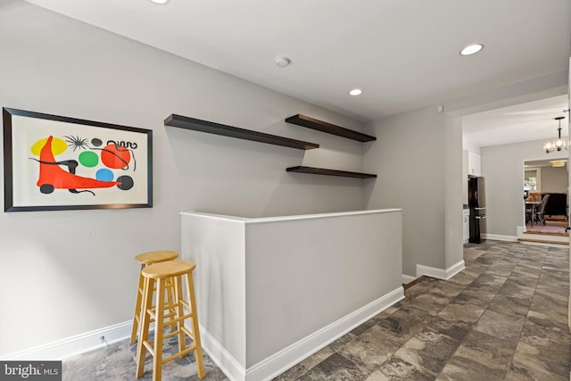 407 Independence Ave SE, Washington, DC 20003 - bar featuring freestanding refrigerator, recessed lighting, and dark stone finish floors