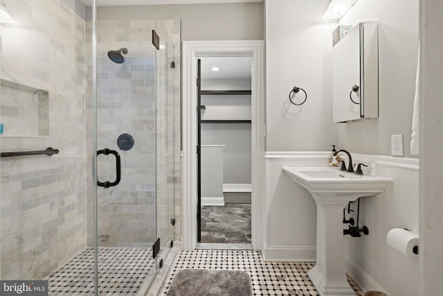 407 Independence Ave SE, Washington, DC 20003 - bathroom featuring a shower stall, a wainscoted wall, and tile patterned floors