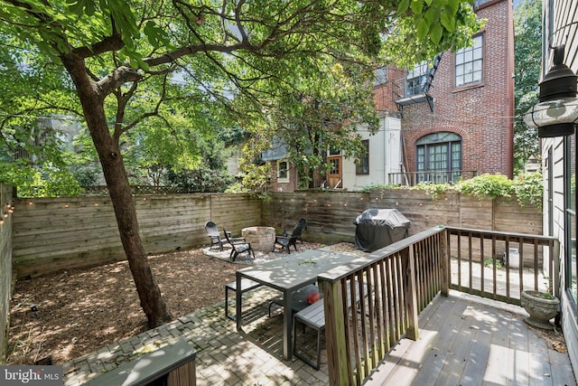 407 Independence Ave SE, Washington, DC 20003 - fenced backyard with grilling area, a fire pit, a patio area, and a deck