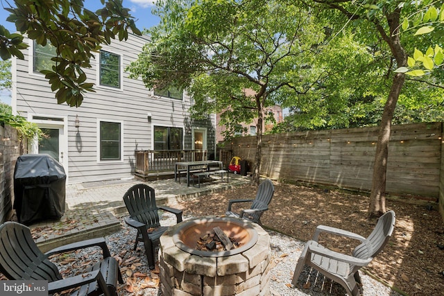 407 Independence Ave SE, Washington, DC 20003 - fenced backyard featuring a fire pit and a patio area