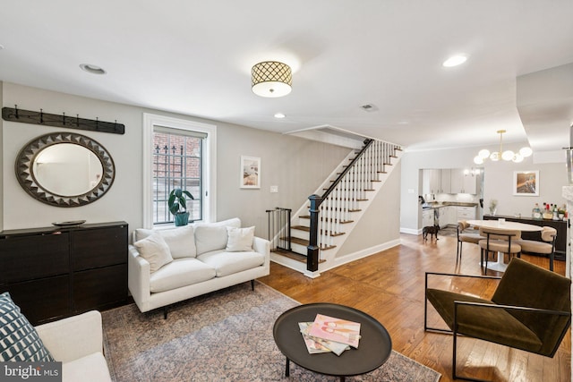 407 Independence Ave SE, Washington, DC 20003 - living area with stairway, wood finished floors, a chandelier, and recessed lighting
