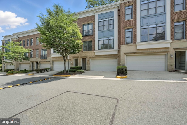 4109 Halsted St, Fairfax, VA 22033 - view of property featuring a garage, brick siding, and driveway