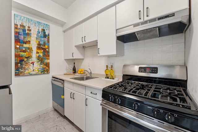 1711 Massachusetts Ave NW Unit 230, Washington, DC 20036 - kitchen with stainless steel gas stove, under cabinet range hood, dishwashing machine, light marble finish flooring, and light countertops