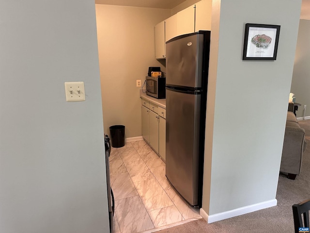 545 Burgoyne Rd Unit 8, Charlottesville, VA 22901 - kitchen with stainless steel appliances, light marble finish flooring, light countertops, and white cabinetry