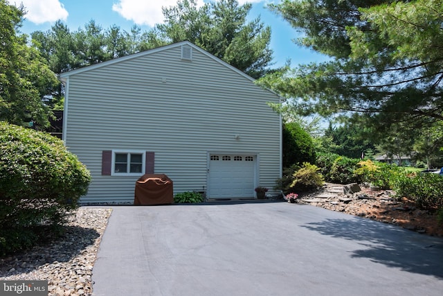 4367 Sunset Ct, Warrenton, VA 20187 - view of side of property with asphalt driveway and a garage