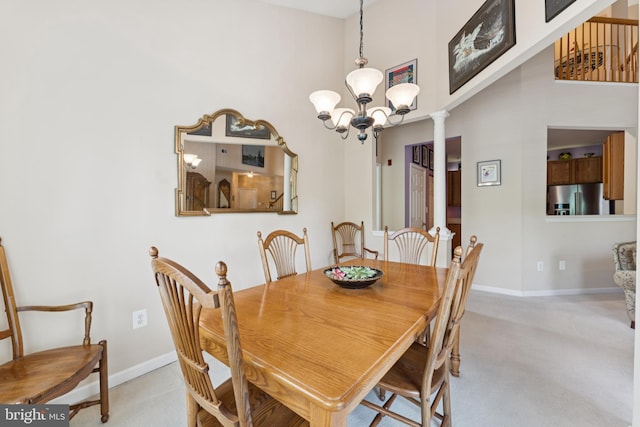 6230 Glen Valley Ter Unit 4L, Frederick, MD 21701 - dining space featuring light colored carpet, a chandelier, a towering ceiling, and ornate columns