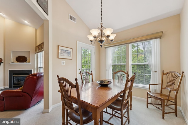 6230 Glen Valley Ter Unit 4L, Frederick, MD 21701 - dining area featuring light colored carpet, a glass covered fireplace, a chandelier, and high vaulted ceiling