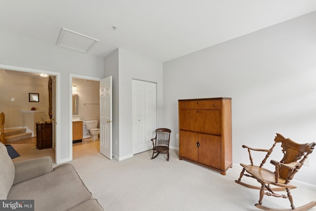 6230 Glen Valley Ter Unit 4L, Frederick, MD 21701 - sitting room with light carpet and attic access