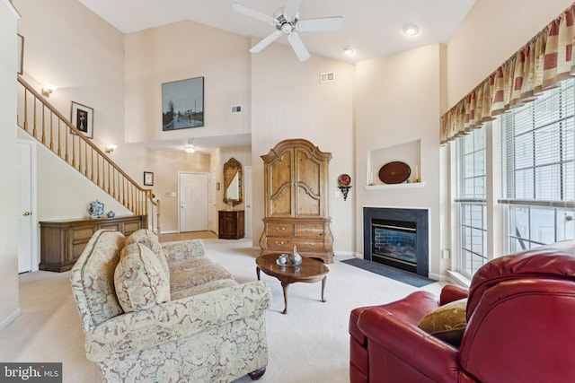 6230 Glen Valley Ter Unit 4L, Frederick, MD 21701 - living area featuring carpet flooring, high vaulted ceiling, stairs, a ceiling fan, and a fireplace with flush hearth