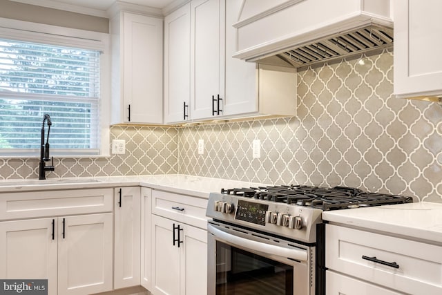 2100 Pot Spring Rd, Lutherville Timonium, MD 21093 - kitchen with stainless steel gas range, custom range hood, light countertops, white cabinetry, and backsplash