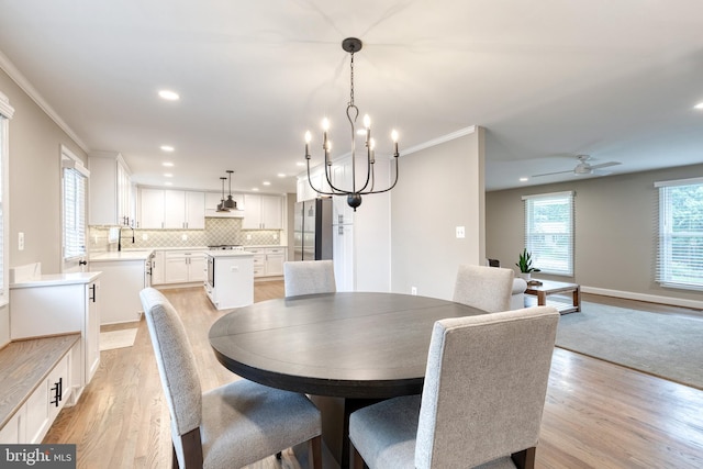2100 Pot Spring Rd, Lutherville Timonium, MD 21093 - dining area with light wood-style flooring, recessed lighting, ornamental molding, a chandelier, and a ceiling fan
