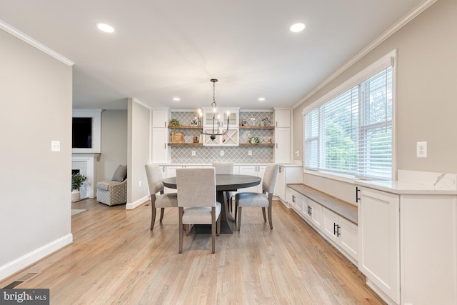 2100 Pot Spring Rd, Lutherville Timonium, MD 21093 - dining room with crown molding, a chandelier, recessed lighting, light wood-style floors, and a fireplace