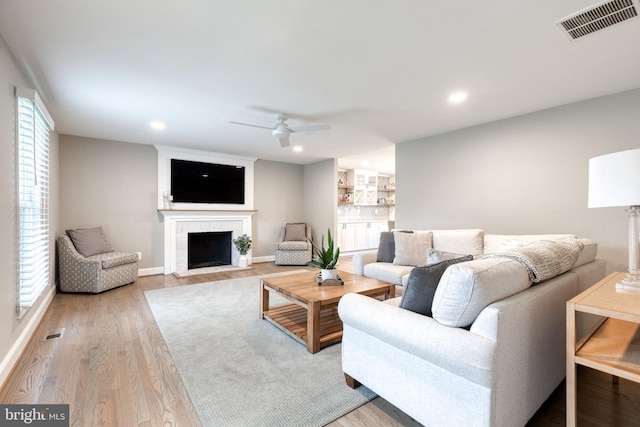 2100 Pot Spring Rd, Lutherville Timonium, MD 21093 - living room featuring ceiling fan, a fireplace with flush hearth, plenty of natural light, light wood finished floors, and recessed lighting
