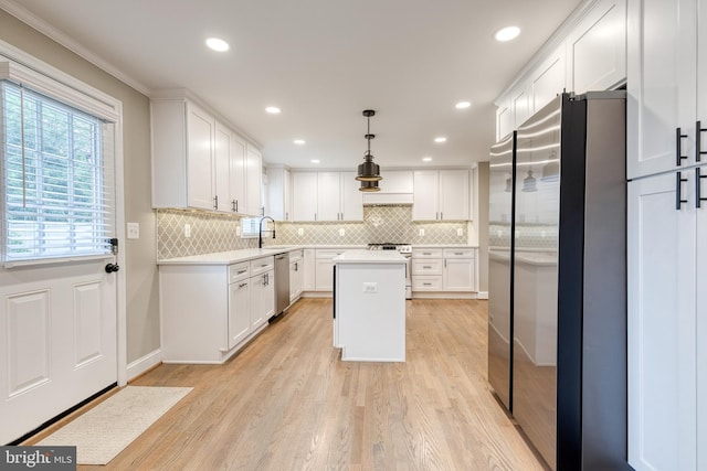 2100 Pot Spring Rd, Lutherville Timonium, MD 21093 - kitchen featuring stainless steel appliances, light countertops, light wood-style flooring, white cabinets, and recessed lighting