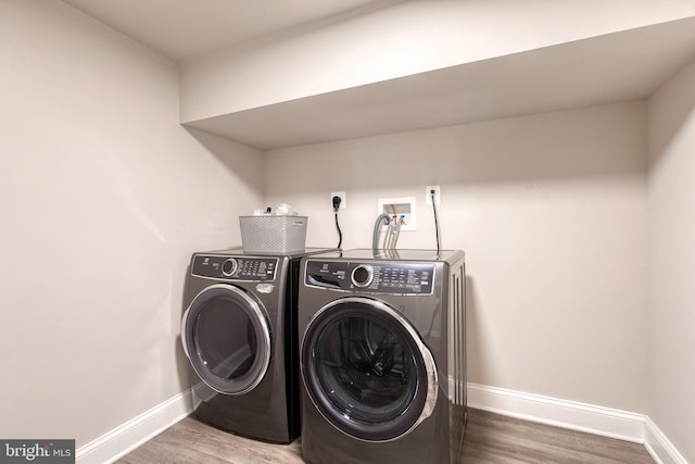 2100 Pot Spring Rd, Lutherville Timonium, MD 21093 - washroom with independent washer and dryer and wood finished floors