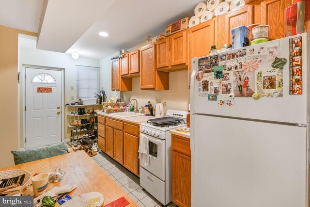 3905 Benton St NW, Washington, DC 20007 - kitchen featuring white appliances, light countertops, light tile patterned flooring, and recessed lighting