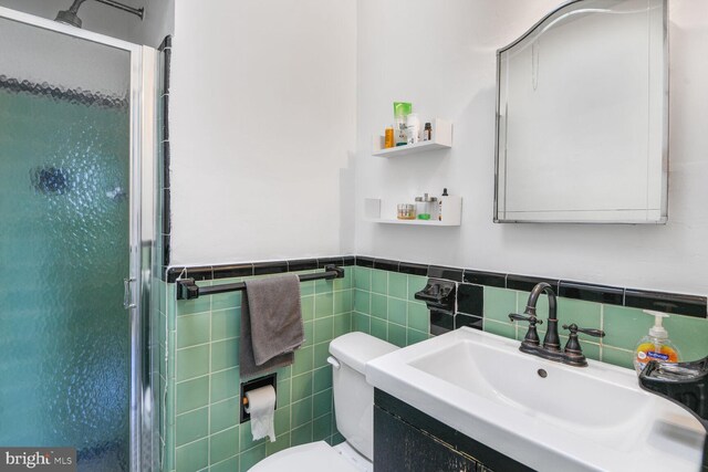 3905 Benton St NW, Washington, DC 20007 - bathroom with a stall shower, vanity, tile walls, and wainscoting