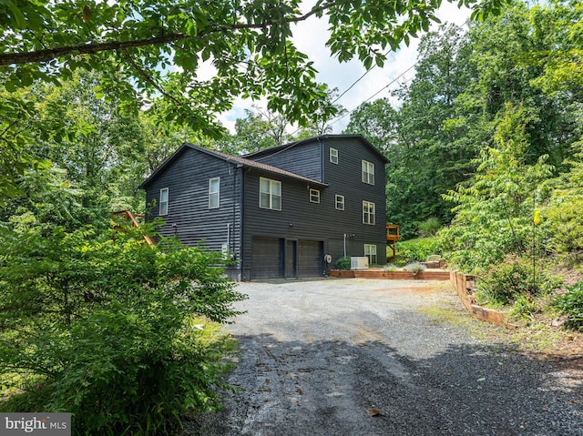 5171 Sandy Stone Ln, Broad Run, VA 20137 - view of home's exterior with a garage and asphalt driveway