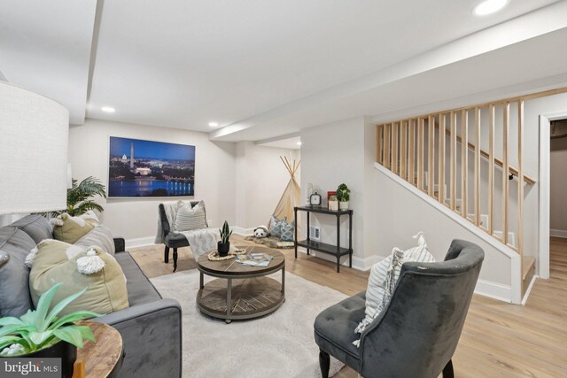 9215 Glenville Rd, Silver Spring, MD 20901 - living area featuring wood finished floors, stairway, and recessed lighting