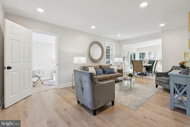 9215 Glenville Rd, Silver Spring, MD 20901 - living area featuring light wood-style flooring and recessed lighting